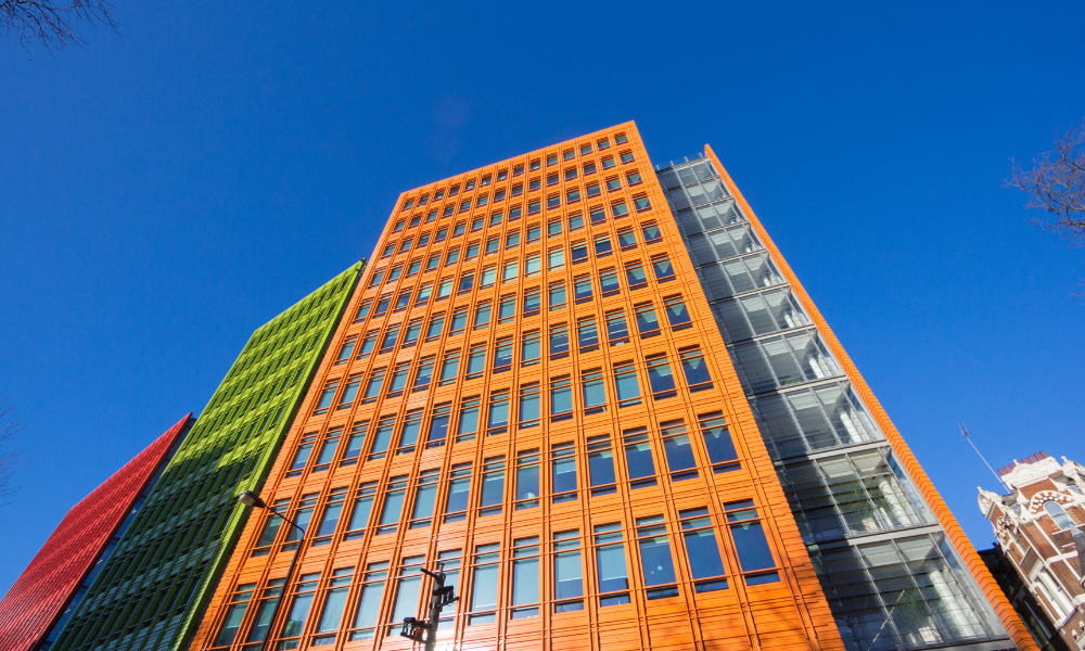 Google the central st Giles building from the bottom, this is the orange panel of the building that we are looking at against a blue sky