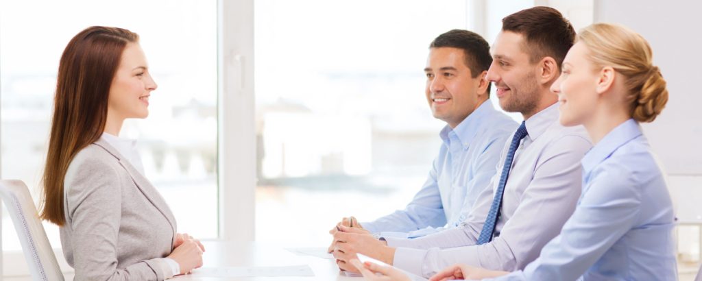 business, career and office concept - smiling businesswoman at job interview in office